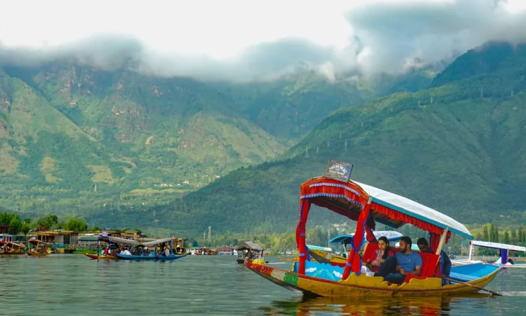Shikara ride on Dal Lake with clouds over the Zabarwan mountains, Srinagar