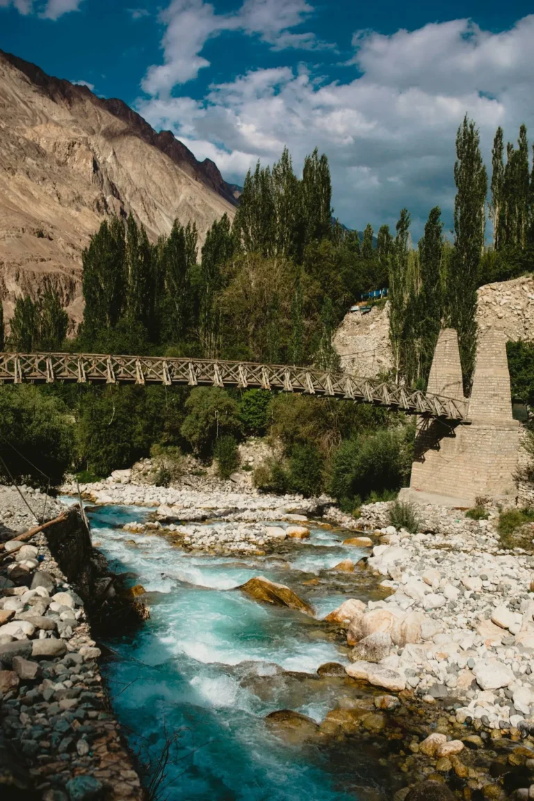 Wooden suspension bridge over a glacial stream in Ladakh