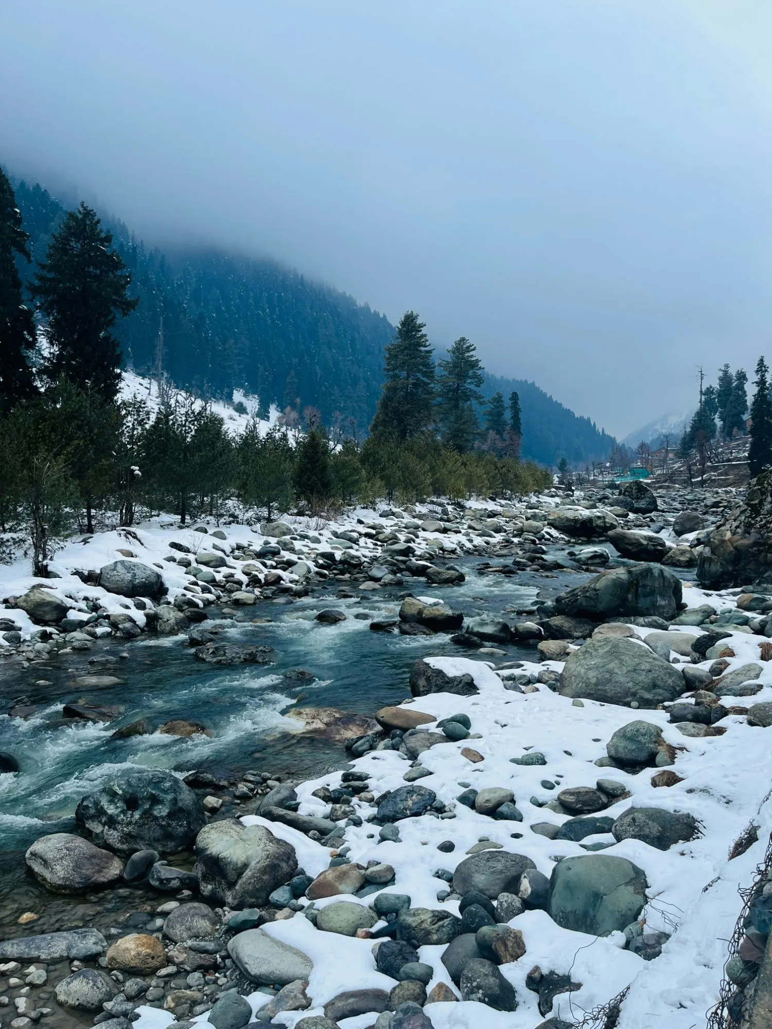 Snow-covered banks of the Lidder River in winter, Pahalgam