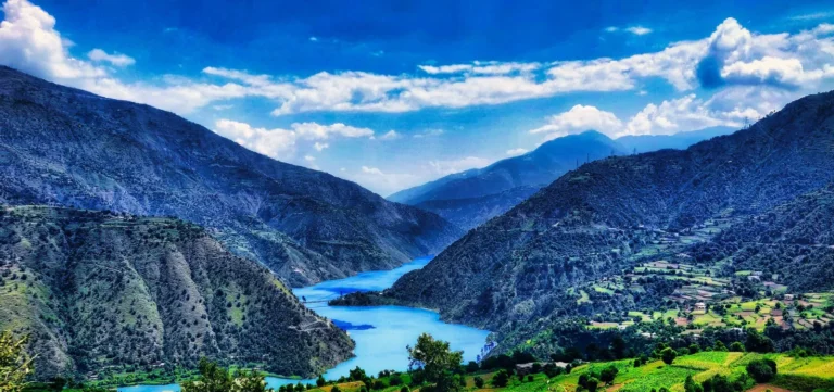 Turquoise river winding through a deep mountain valley in Jammu and Kashmir
